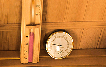 Traditional Thermometer and Hourglass
